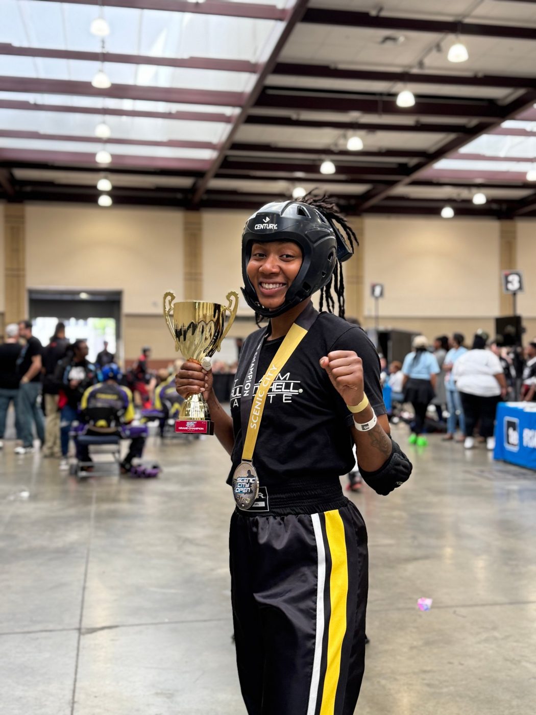 Ki'Tana Everett with her grand champion trophy at the Scenic City Open